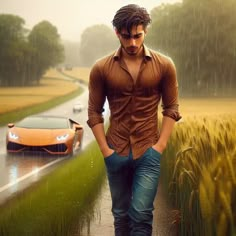 a man is standing in the rain next to a car and a field with grass