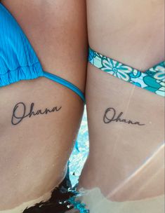 two girls with matching tattoos on their stomachs that say ohana and ohana