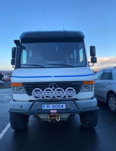 a mercedes benz truck parked in a parking lot