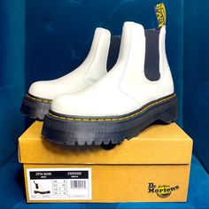 New Doc Martens White Smooth Leather Platform 2976 Quad Chelsea Boot. Tried On Only. Comes With Box. Excellent, New Condition. Elastic Gussets Pull-On Chelsea Boot Style Constructed On The Iconic And Comfortable Dr. Martens Air-Cushioned Sole, With A Commando Tread Built To Last With A Durable Goodyear Welt Made With All The Classic Docs Dna, Including Grooved Sides, Heel-Loop And Yellow Stitching Made With Smooth, The Original Super-Durable Dr. Martens Leather Platform Height: 1 1/2 In; Heel He White Lug Sole Boots For Streetwear, White Boots With Rubber Sole For Streetwear, White Boots With Vibram Sole For Streetwear, White Leather Boots With Rubber Sole, Dc Martens Platform, Black And White Doc Martens, White Platform Doc Martens, White And Black Doc Martens, Dr Martens Platform Boots White