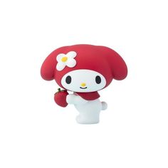 a little red and white figurine with a flower on it's head