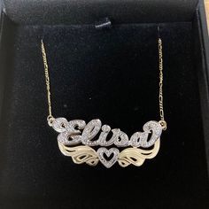 "Stand out and make a statement with our fully loaded double plated name necklace collection. Personalize your necklace with your name or a special word below. Letters and heart are studded with 20 sparkling quality cz crystal set on rhodium cut. Rhodium is 7 times more expensive than gold and it does not tarnish and gives a brilliant shine which makes stone sparkle more. This necklace comes with a Free Figaro Chain. 💖 Item Specification 💖 Material: 925 sterling silver solid The Name Necklace Silver Cubic Zirconia Nameplate Necklace, Diamond Accent Nameplate Necklace, Diamond Nameplate Necklace With Diamond Accents, Personalized Cubic Zirconia Nameplate Necklace, Gift Nameplate Necklace With Diamond Accents, Custom Name Diamond Nameplate Jewelry, Silver Nameplate Necklace With Diamond Accents, Gold Sterling Silver Name Necklace With Diamond Accents, Personalized Gold Name Necklace With Diamond Accents