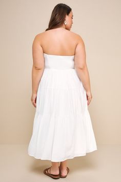 It's easy to fall in love with your reflection when you're wearing the Lulus Sweetness and Sunshine White Strapless Midi Dress With Pockets! Lightweight woven fabric shapes this essential summer dress that has a strapless bodice (with hidden no-slip strips) and a seamed bodice. High waist tops a tiered skirt (with side seam pockets) that features a decorative button placket, running from the neckline to the midi hem. Smocked panel at back for fit. Fit: This garment fits true to size. Length: Mid Bandeau Mini Dress With Smocked Back For Beach, Beach Season Strapless Sundress, Chic Beach Maxi Dress With Sweetheart Neckline, Strapless Sundress With Adjustable Straps For Brunch, Summer Bandeau Mini Dress For Beach, Summer Bandeau Beach Mini Dress, Summer Midi Dress With Sweetheart Neckline And Lining, Chic Bandeau Midi Dress For Summer, Flowy Strapless Sundress For Summer