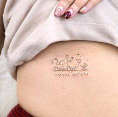 a woman's stomach with the words makina matata written on it