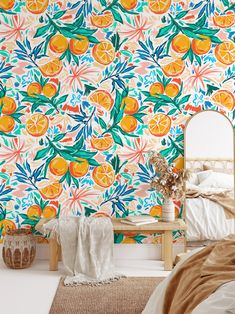 a bedroom with oranges and leaves wallpaper on the walls next to a bed