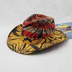 If you're looking to express your trend in a unique way, this unisex cowboy hat is a perfect choice. Made with high-quality paper, it adds a touch of style to your look. The vibrant print pattern and beautiful color make it a standout accessory. With its affordable price and stylish design, this cap is a must-have addition to your collection.Specifications Style: Casual Place Of Origin: China (Mainland) Pattern Type: Print Origin: Mainland China Material: Paper Item Type: Cowboy Hats Gender: Unisex Feature: Decorate Department Name: Adult CN: Zhejiang Brand Name: GeraldBlack Applicable Season: Four Seasons Applicable Scene: Party When purchasing clothing, shoes, and/or belts; please follow the size chart. Please click on "Size Charts" located on the menu bar to learn how to get your measur Retro Short Brim Hat For Western-themed Events, Retro Summer Hats For Country Events, Fedora Straw Hat For Western-themed Events, Multicolor Fedora With Curved Brim For Rodeo, Multicolor Flat Brim Straw Hat For Rodeo, One Size Fedora Straw Hat For Western-themed Events, Retro Adjustable Hat For Rodeo, Adjustable Top Hat For Summer Country Events, Summer Adjustable Top Hat For Country Events