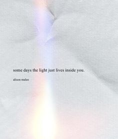 a white sheet with a rainbow colored light coming out of the center and some words written on it