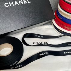 Classic Chanel Logo Ribbon With White Lettering On A Black Background, Never Used And Perfect For Crafting, Gifts And Hair Ribbon! Measures 5/8” X 1 Yard. Message For Longer Lengths And Join My Live Show To See In Person! Please Note: Due To Poshmark’s Recent Change (10/03) In Fee Structure, The Price Of This Item Has Been Reduced In Order To Alleviate The Newly Charged Fee For The Buyer, I Believe You Should Not Have To Sacrifice An Opportunity To Treat Yourself Or Someone You Love! I Am Always Chanel Ribbon, Chanel Camellia Flower, Crafting Gifts, Chanel Long Wallet, Chanel Party, Chanel Black And White, Black And White Ribbon, Classic Chanel, Black Packaging