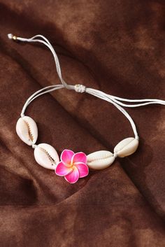 Experience the beauty of the ocean with our White Flower Seashell Adjustable Bracelet. Handcrafted with delicate white seashells, this bracelet adds a touch of elegance to any outfit. The adjustable design ensures a perfect fit for all. Bring a piece of the sea wherever you go. Flowers And Seashells, White Seashells, Ballroom Shoes, Polymer Clay Bracelet, Formal Wear Dresses, Clay Bracelet, Silk Pajama Set, Delicate Flowers, Beach Vibes