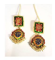 red Green Navy Meena Pearl EARRINGS If you like to make a statement with your jewelry then this is the piece to own Elongated Gold plated Traditional Kundan Earrings **Made in pure .925 sterling silver base and 18 K Gold plated. **Paisley style chandelier earrings, hand enameled with real pearls along the edges with elegant royal hand painted motif an elegant fusion design. **Fresh Water Pearls on the bottom **Length- 3.25 inches and width - 1.2 inch at the widest point These earrings will be sh Multicolor Gold Plated Dangle Jewelry, Multicolor Dangle Gold Plated Earrings, Red Gold Plated Temple Jewelry, Traditional Green Jewelry With Motifs, Red Gold-plated Temple Jewelry, Multicolor Gold Plated Earrings For Diwali, Multicolor Gold-plated Earrings For Diwali, Multicolor Gold Plated Earrings For Festive Occasions, Gold Plated Green Earrings For Celebration