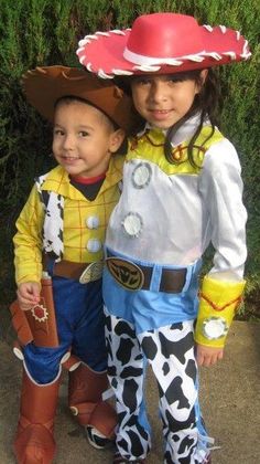 two children dressed up as toy story book characters, one wearing a cowboy hat and the other in costume