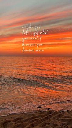 an orange and pink sunset over the ocean with a poem written in white on it