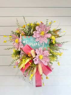 a pink and yellow wreath with the words hello sunny on it