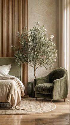 a bedroom with a bed, chair and olive tree in the corner next to it