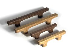 three pieces of wood sitting next to each other