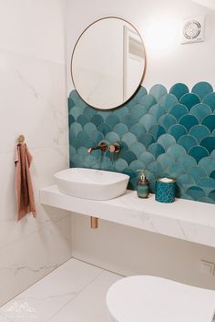 a bathroom with two sinks and a mirror on the wall next to a bathtub