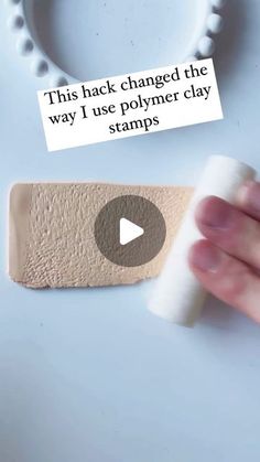 someone is holding a piece of paper with the words, this hack changed the way i use polymer clay stamps