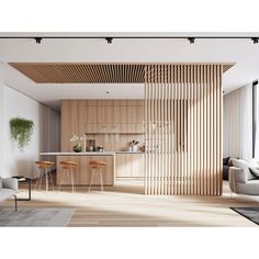 an open concept kitchen and living room with wood slats on the wall, white sofas and chairs