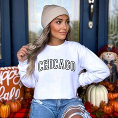 Introducing our cozy and stylish Chicago sweatshirt! Show your Windy City pride with this must-have addition to your wardrobe. Crafted from premium quality fabric, this sweatshirt offers ultimate comfort while keeping you warm on chilly Chicago days. Whether you're strolling through Millennium Park or cheering on the Cubs at Wrigley Field, this Chicago sweatshirt is a perfect way to showcase your love for the Second City. Get ready to turn heads and start conversations with this unique and fashionable piece. Grab yours today and let your Chicago spirit shine! SIZE UP 1-2 SIZES FOR AN OVERSIZED LOOK! Thanks so much for shopping with me! Please message me with any questions you may have! I am always available to help!  📝Please note that, due to variations amongst computer monitors, actual c Winter College Style Crew Neck T-shirt, White College Style Tops With Ribbed Cuffs, Trendy White Cozy Fit Top, Cozy Crew Neck Tops For College, White Collegiate Sweatshirt For Winter, White College Style Sweatshirt For Winter, Trendy Cozy Fit Crew Neck Top, College Style Text Print Tops For Fall, White Letter Print Cozy Top