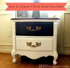 a black and white dresser with gold handles