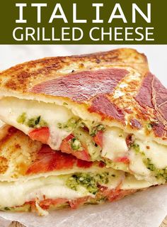 a grilled cheese sandwich with broccoli and tomatoes on it is stacked high