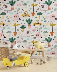 a child's room with colorful wallpaper and toys