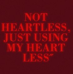 a red neon sign that says not heartless, just using my heart less