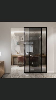 an office with glass walls and marble floors