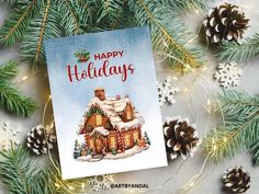 a christmas card with an image of a house in the snow surrounded by pine cones