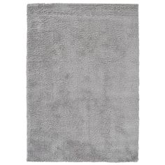 a gray rug on a white background with no one in it or someone out there