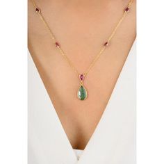 This stunning necklace features a modern teardrop-shaped emerald and a pear-cut ruby, both elegantly suspended from a delicate chain. The vibrant green and deep red gemstones create a striking contrast, making it a perfect statement piece for any occasion. The sleek design exudes contemporary sophistication and timeless beauty. Emerald enhances the intellectual capacity. Designed with a pear cut emerald set in bezel settings in a chain of the necklace to make you stand out of the crowd. This is Teardrop Ruby Necklace In Yellow Gold, Classic Pear-shaped Emerald Necklace, Formal Pear-shaped Ruby Necklace, Red Pear-shaped Gemstone Necklace, Pear-shaped Ruby Gemstone Necklace, Mother Daughter Gifts, Red Gemstones, Pear Cut, Stunning Necklace