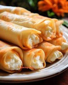 some food is sitting on a plate and ready to be eaten with chopsticks