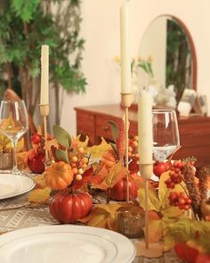 a dining room table set for thanksgiving dinner