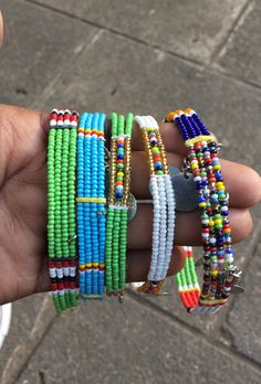 This is a unique design of the African Masai anklets originally from Kenya. it has some added decoration which gives them a beautiful look while worn. It can be worn on different occasions. and the multi-colors on it makes it fit well with all attires. Customization is done according to the clients preferred colors and sizes. shipping is through the DHL Express. Thank you. African Anklet Beads, Traditional Anklets With Round Beads, Green Beads For Festivals, Traditional Green Beaded Bracelets For Festival, Traditional Green Beaded Bracelets, African Anklets, Masai Jewelry, Random Jewelry, Waist Jewelry