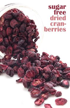 dried cranberries spilling out of a glass jar with the words sugar free dried cranberries