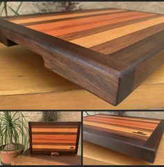 a wooden cutting board sitting on top of a table next to a potted plant