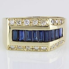 Vintage 14k Yellow Gold Sapphire And Pav Diamond Anniversary / Cocktail Ring Stunning Vintage 14 Karat Yellow Gold Anniversary Ring Features 9 Beautiful Baguette-Cut Sapphires And 16 Gorgeous Round Diamonds Set Along The Top And Down One Side Of The Shank. The Band Is A Size 9.75, But Can Be Resized By Any Qualified Jeweler. "Va14k" Is Stamped Onto The Inner Part Of The Band. Size: 9.75 (Resizable) // 3.8mm - 11mm Band Width Metal: 14 Karat Yellow Gold Weight: 5.36 Dwt // 8.33 Grams Gemstones: 9-Baguette-Cut Sapphires (2.0 Carat Total) Diamonds: 16-Round (.38 Carat Total) 828589-1 * D-579 Yellow Gold Anniversary Rings, Payment Receipt, Round Diamond Setting, Gold Anniversary, Diamond Anniversary, Mens Accessories Jewelry, Baguette Cut, Anniversary Ring, Cocktail Ring