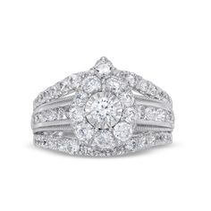 a diamond ring with two rows of diamonds on the band and an oval shaped center surrounded by smaller round brilliant cut diamonds