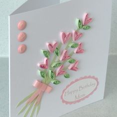 a birthday card with pink and green flowers