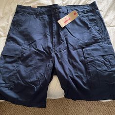 Levi’s Navy Blue Cargo Shorts Size 40 Nwt Relaxed Fit Mid-rise Shorts With Patch Pockets, Mid-rise Relaxed Fit Shorts With Patch Pockets, Blue Cargo Pocket Shorts, Blue Cargo Shorts For Summer, Blue Shorts With Side Pockets, Blue Cotton Cargo Shorts, Blue Short Bottoms With Patch Pockets, Relaxed Fit Mid-rise Cargo Shorts, Blue Cargo Shorts With Pockets For Summer