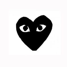 a black heart with eyes drawn on the front and back side, against a white background