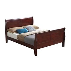 a wooden bed frame with blue pillows on it