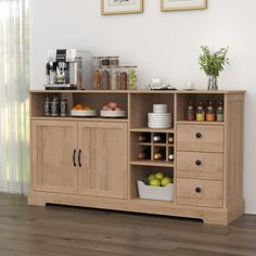 a wooden cabinet filled with lots of food and drinks on top of a hard wood floor