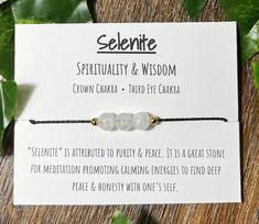 Selenite adjustable bracelet, selenite spirituality and wisdom bracelet, crown and third eye chakra bracelet, holistic jewelry Choose cord color from the menu.  Choose metal bead type from the menu. Adjustable size fits most adults and children. Easily adjusts down to the stones and fits small sizes easily. Contains 3, 6mm crystal beads and 4, 2mm metal accent beads. Adjustable bracelet with a labeled meaning card attached. Genuine selenite with metal accents on an adjustable wax cord. Card: "Se Adjustable Spiritual Moonstone Bracelets, Adjustable Moonstone Crystal Bracelet For Meditation, Spiritual White Crystal Bracelet, White Hand Wrapped Spiritual Crystal Bracelet, Spiritual White Hand Wrapped Crystal Bracelet, Spiritual White Hand-wrapped Crystal Bracelet, Adjustable Spiritual Moonstone Beaded Bracelets, Adjustable Spiritual Crystal Bracelet For Friendship, Adjustable White Holistic Bracelets