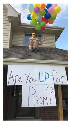 a sign that says are you up for prom? on the roof of a house