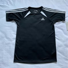 Adidas Boys Soccer Short Sleeve T-Chirt Black Size L 14-16 100%Polyester Black Sporty Short Sleeve Shirt, Adidas Black Tops With Three Stripes, Black Adidas Tops For Sports, Adidas Black Crew Neck Shirt, Adidas Sporty Short Sleeve Tops, Adidas Short Sleeve Moisture-wicking Top, Black Three Stripes T-shirt For Sports, Black Crew Neck T-shirt With Three Stripes, Sporty Black T-shirt With Three Stripes Branding