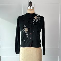 Vintage 1960s Plymouth women's black, silver and white floral beaded angora sweater.  Excellent condition, size XS/  Detailed measurements: Bust - 35 inches Waist - 33 inches Body Length - 20 inches 60s Floral, Angora Sweater, Vintage 60s, Vintage 1960s, Plymouth, Cardigans For Women, Black Silver, Varsity Jacket, 1960s