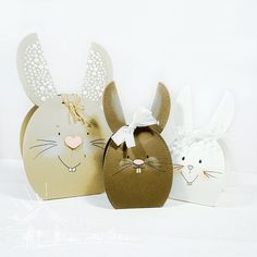 two brown and white easter bunnies sitting next to each other