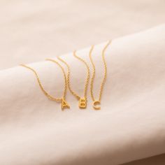 ⚡️Trending Alert: Popular and in high demand ⚡️ Give the gift of subtle elegance this holiday season with our Dainty Initial Necklace. Perfectly customizable, this delicate piece adds a meaningful touch to any look. Ideal for layering or wearing solo, it’s a thoughtful and stylish Christmas gift for someone special.. Material: High Quality Solid 925 Sterling Silver Finish: 18K Gold Featuring ~ 6mm Initial Charm on an adjustable 16 to 18 inch chain. Model is wearing the 17 inch length in the firs Sideways Initial Necklace, Dainty Initial Necklace, Custom Pendant, Knot Studs, Initial Pendant Necklace, Stylish Necklace, Custom Pendants, Trendy Necklaces, Initial Letter