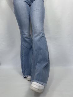 Bia Bell Bottom Jeans Jeans are true to size! Oversized (extremely long) Size runs small Wide leg Back pockets Stretchy Unfinished hem High waisted Belt loops on waist Model is 5'7 wearing a size 7 Fabric: 60%Cotton, 32%Modal, 7%T400, 1%Lycra